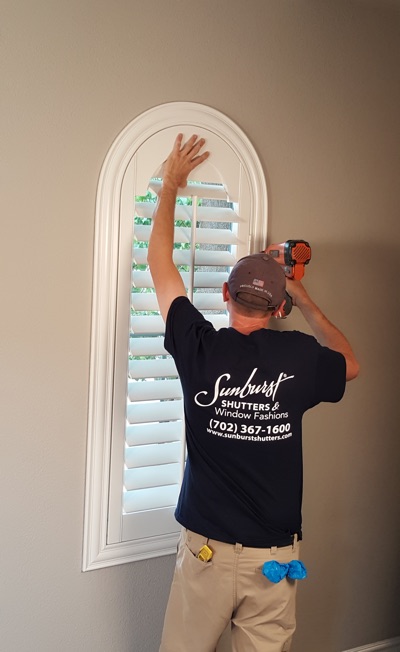 Shutter install in Chicago living room